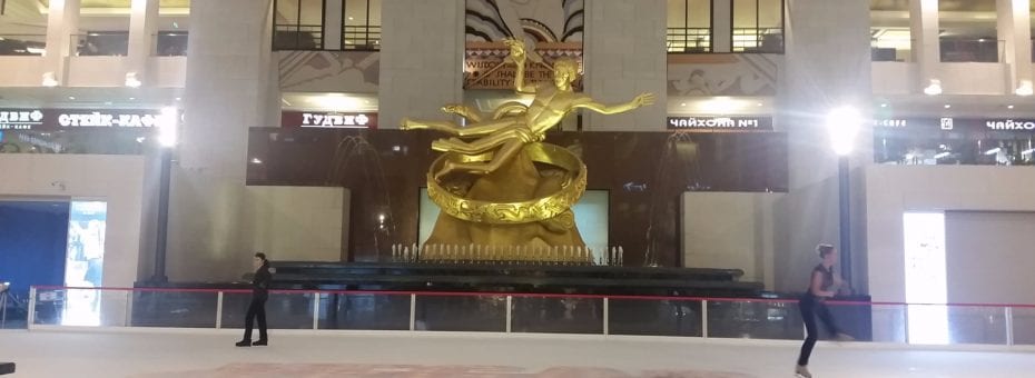 The ice rink in the mall, complete with a huge golden statue.