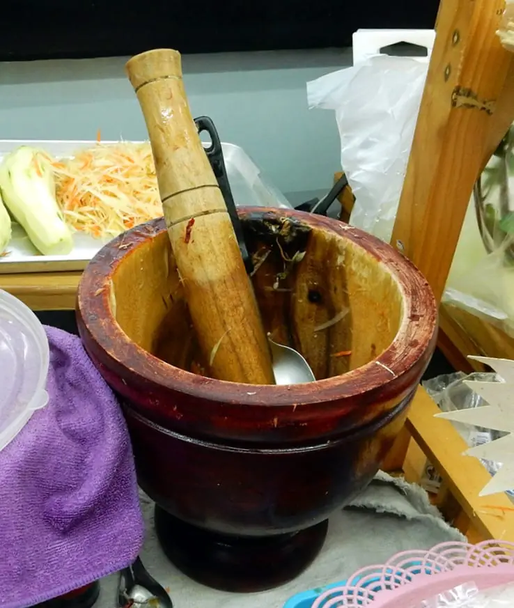 Chiang Mai, Thailand: Wooden bowl and pestle used by street vendors to make fresh papaya salads