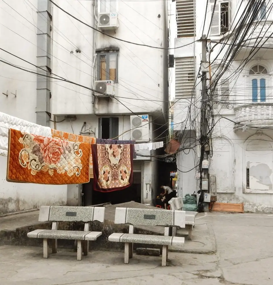 Hanoi, Vietnam: blankets over an electrical wire clothing line!
